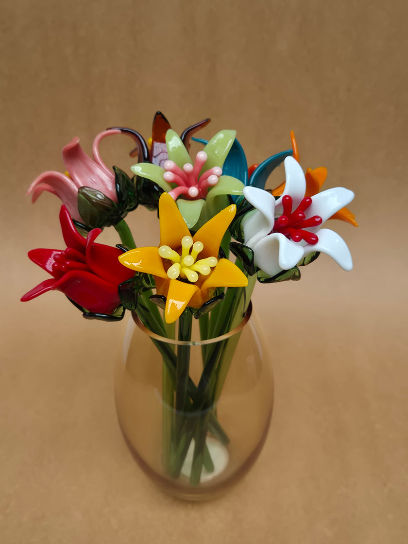 Colorful glass flowers on a beige background