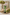 Decorative setting with flowers, candle, and decorative elements on a table.