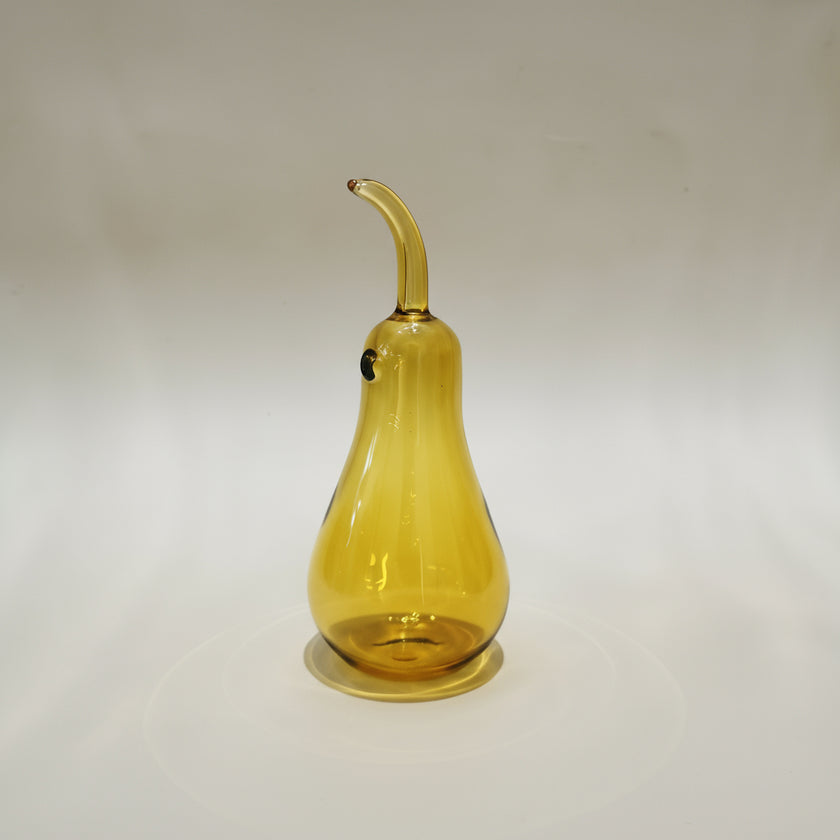 Handblown glass pear-shaped decoration with a Murano style design, featuring a smooth amber color.