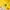 Glass of lemon water with a straw on a yellow background